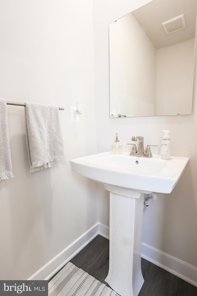 bathroom featuring hardwood / wood-style floors and sink