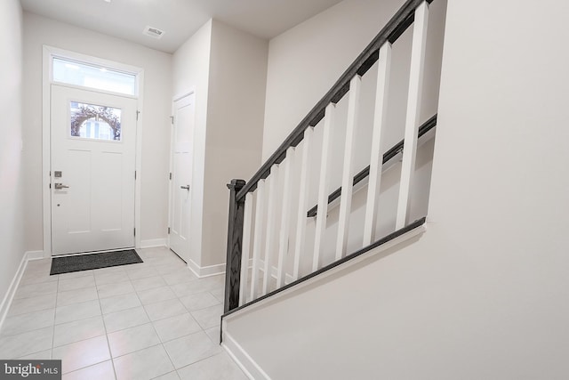 entryway featuring light tile patterned floors