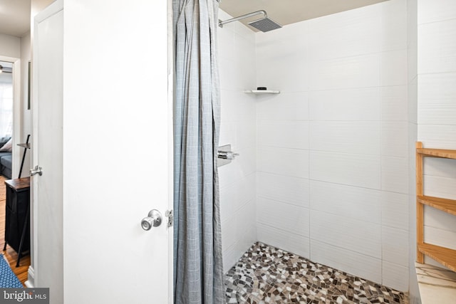 bathroom featuring a shower with curtain