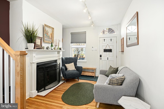 living area with hardwood / wood-style floors