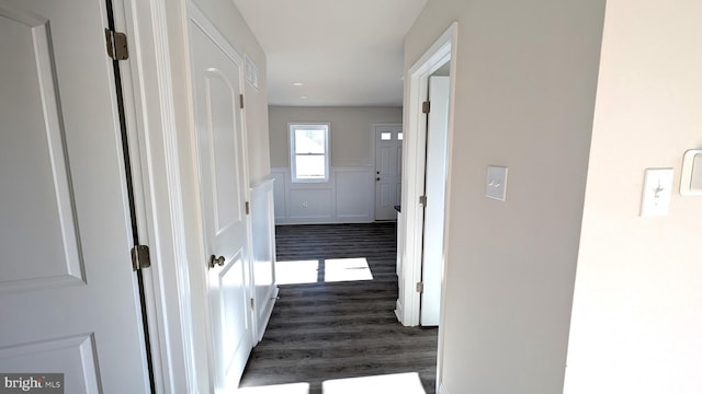 corridor featuring dark hardwood / wood-style flooring