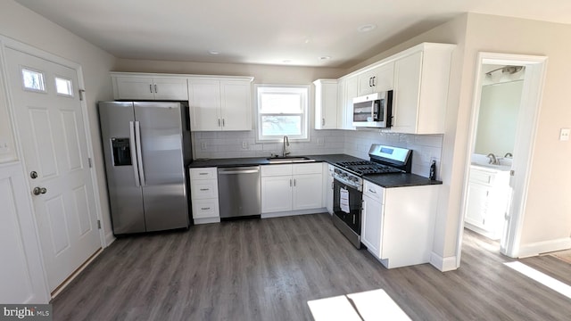 kitchen featuring white cabinetry, sink, and appliances with stainless steel finishes