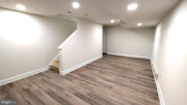 basement featuring hardwood / wood-style floors