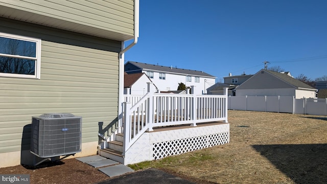 exterior space featuring cooling unit and a deck