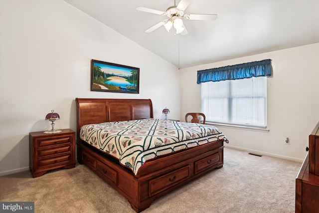 carpeted bedroom with ceiling fan and lofted ceiling