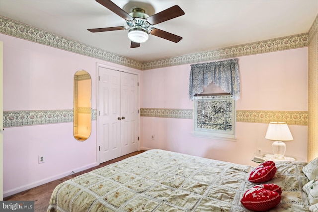 bedroom with ceiling fan and a closet