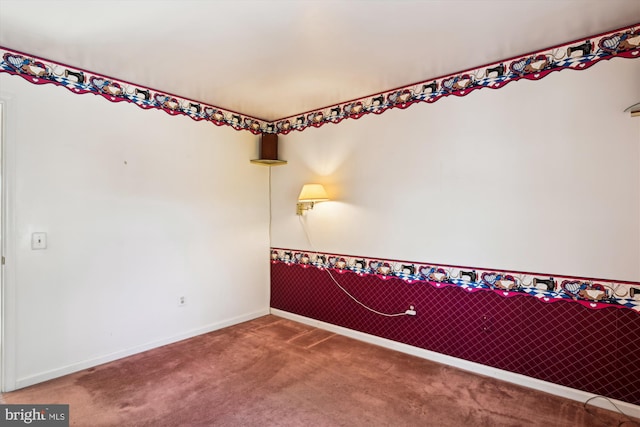 unfurnished room featuring carpet