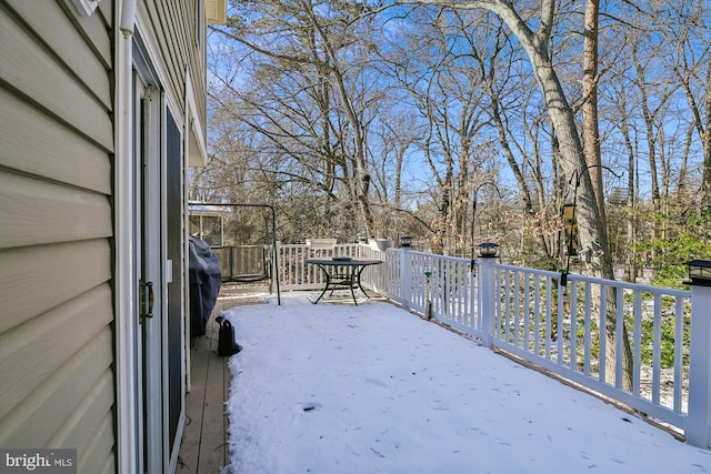 view of snow covered deck