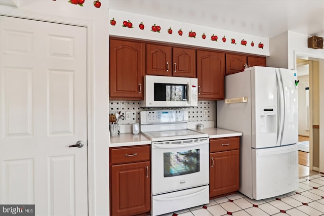 kitchen featuring white appliances and decorative backsplash