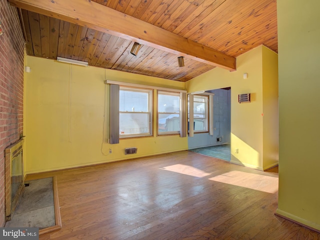 unfurnished living room featuring a brick fireplace, light hardwood / wood-style floors, lofted ceiling with beams, and wooden ceiling