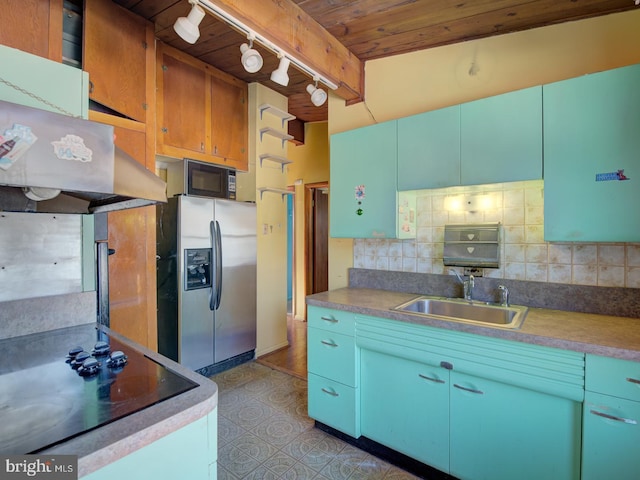 kitchen with wood ceiling, stainless steel refrigerator with ice dispenser, decorative backsplash, sink, and rail lighting