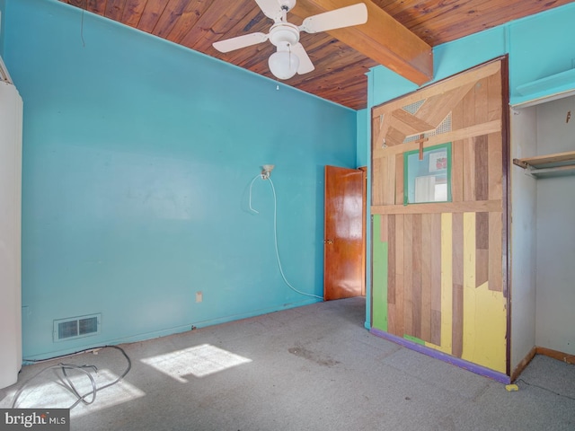 unfurnished bedroom with light carpet, beam ceiling, and ceiling fan