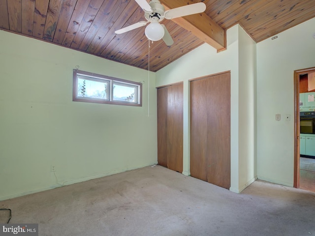 unfurnished bedroom with light carpet, wooden ceiling, lofted ceiling with beams, and ceiling fan