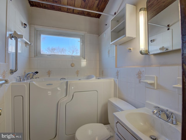 bathroom featuring tile walls, tasteful backsplash, wood ceiling, toilet, and vanity