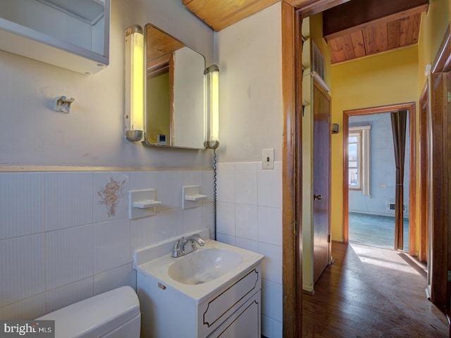 bathroom featuring hardwood / wood-style floors, toilet, and vanity