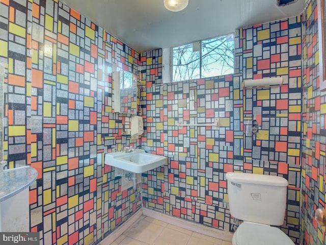 bathroom featuring toilet and tile patterned floors