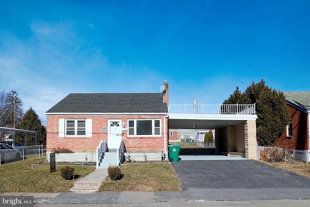 view of front facade with a carport