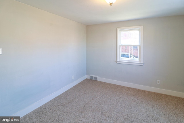 spare room featuring carpet