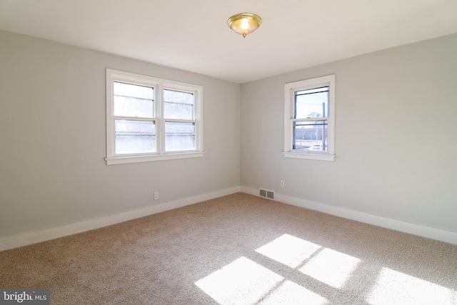 unfurnished room featuring carpet floors