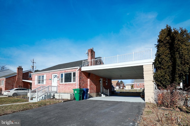 view of front of home featuring a carport