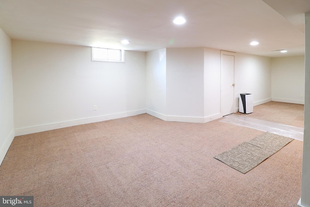 basement with light colored carpet