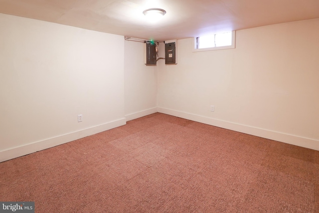 basement featuring carpet flooring and electric panel