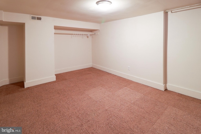 unfurnished bedroom with a closet and carpet floors