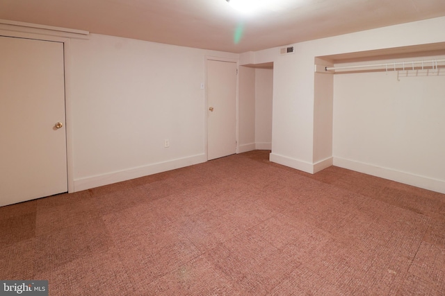 unfurnished bedroom featuring a closet and carpet floors