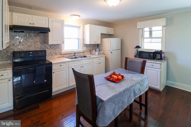 kitchen with sink, white cabinetry, decorative backsplash, dark hardwood / wood-style flooring, and black appliances