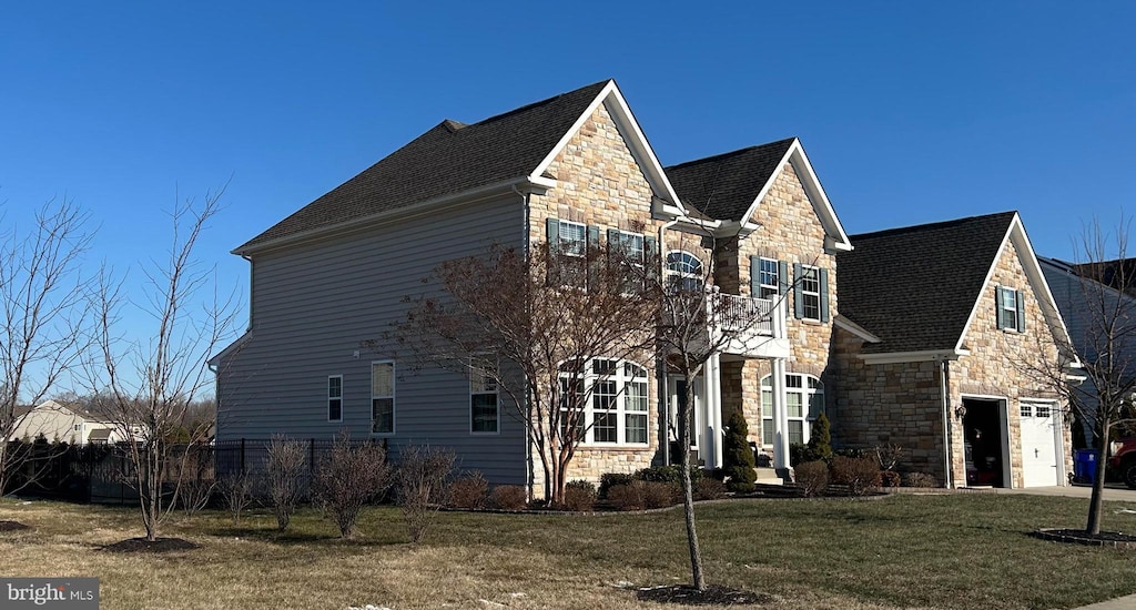 view of front of home with a garage and a front yard