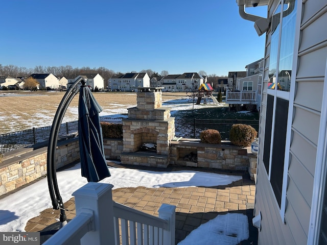 view of patio featuring an outdoor stone fireplace