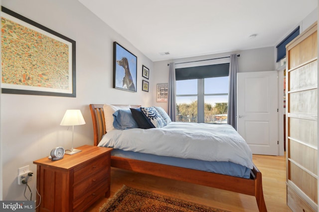 bedroom featuring wood-type flooring