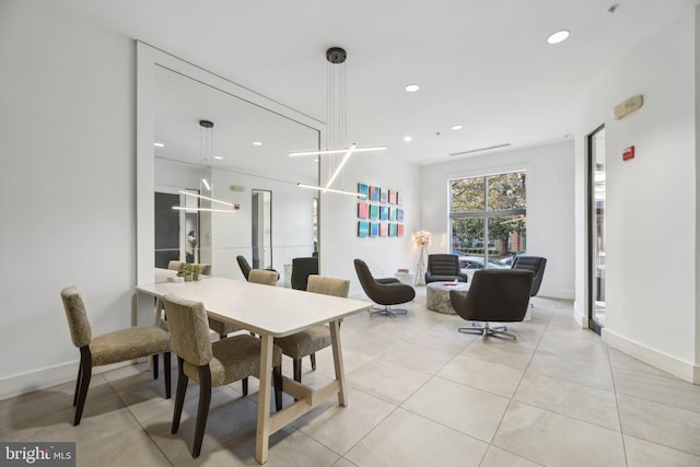 dining space featuring light tile patterned flooring