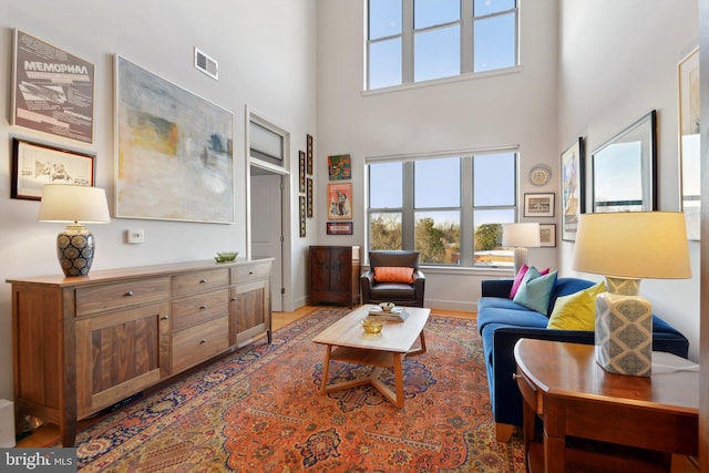 living room with a towering ceiling