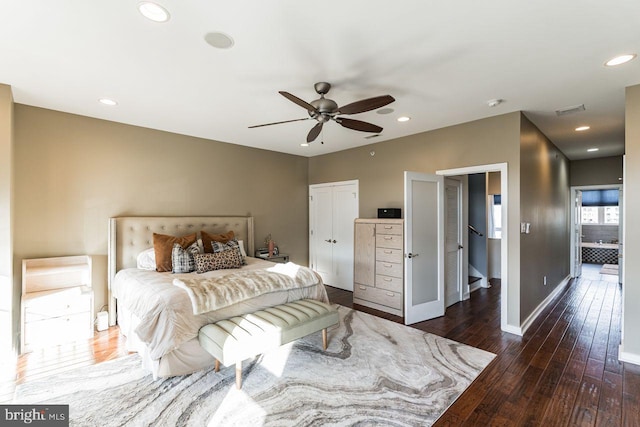 bedroom with ceiling fan and dark hardwood / wood-style flooring