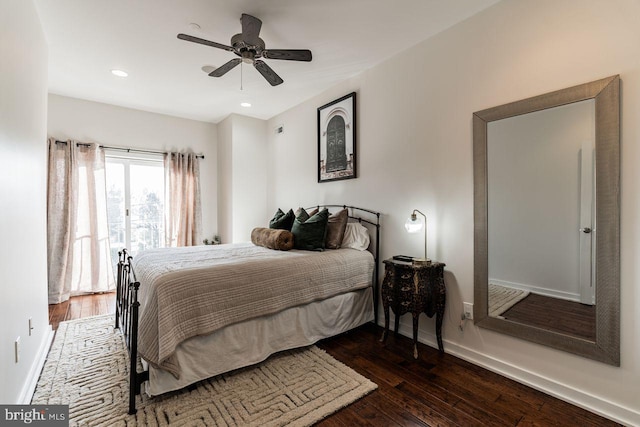 bedroom featuring ceiling fan and dark hardwood / wood-style floors