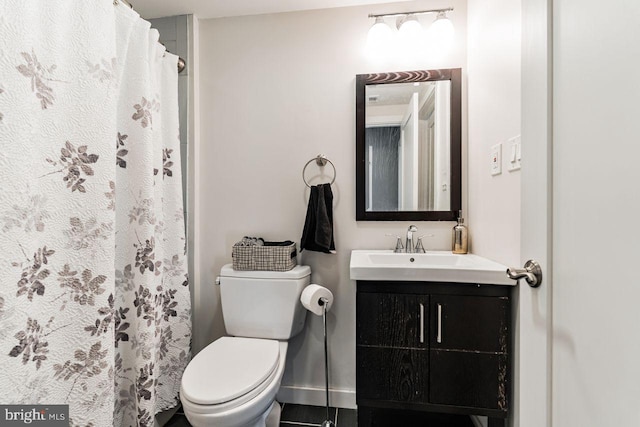 bathroom with vanity and toilet