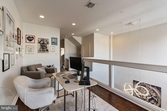 office space with wood-type flooring