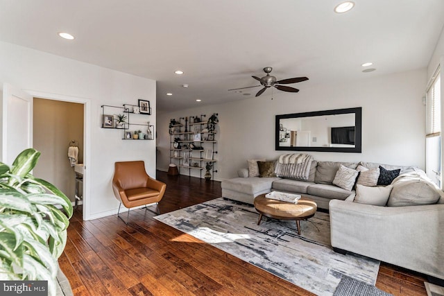 living room with ceiling fan and dark hardwood / wood-style floors