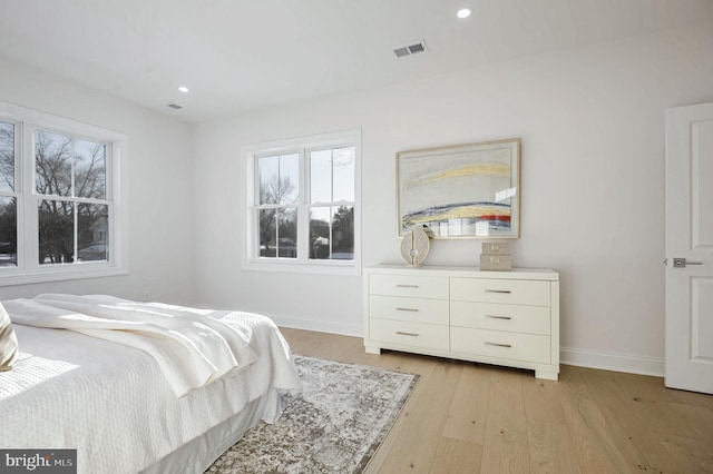 bedroom with light hardwood / wood-style flooring