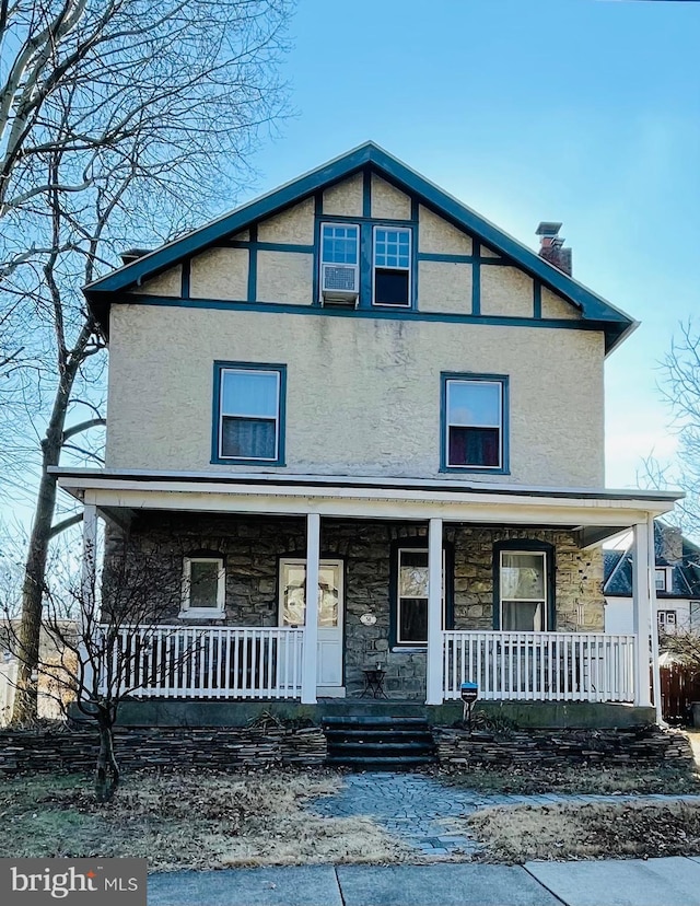 view of front of house with cooling unit and covered porch