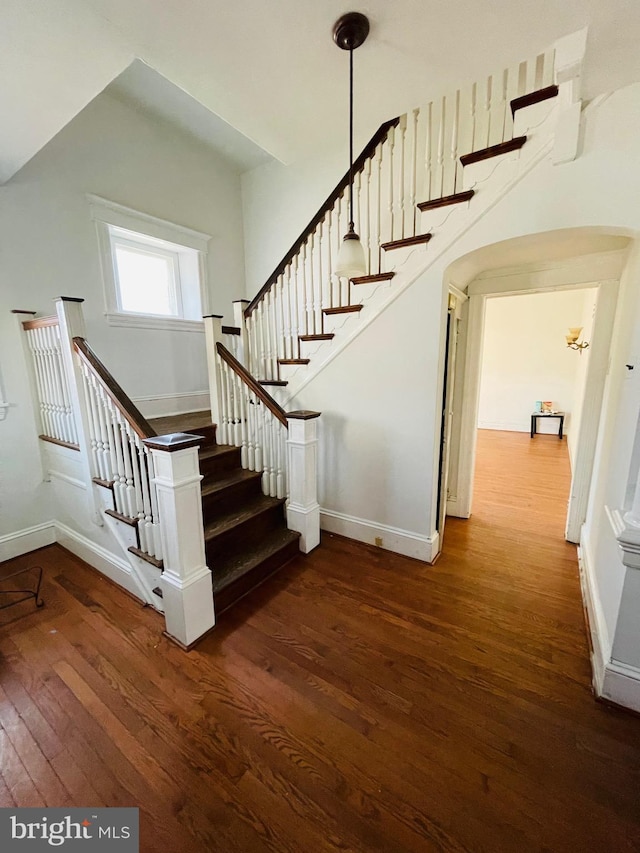 stairs with hardwood / wood-style flooring