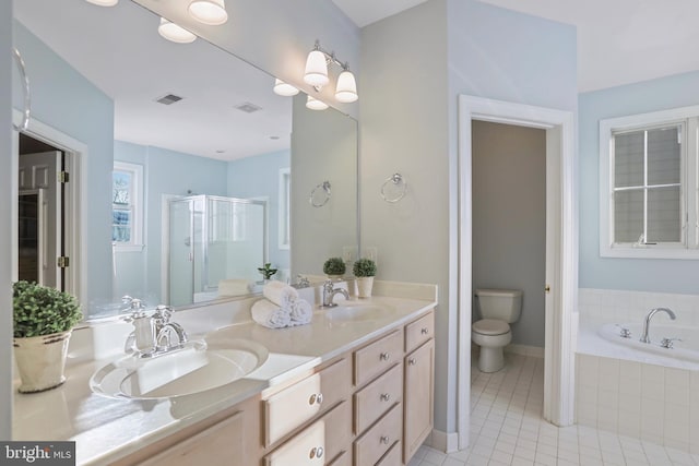 full bathroom featuring toilet, shower with separate bathtub, vanity, and tile patterned floors