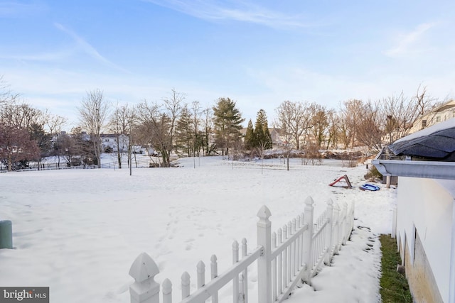 view of yard covered in snow