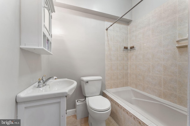 full bathroom with toilet, tiled shower / bath combo, and vanity