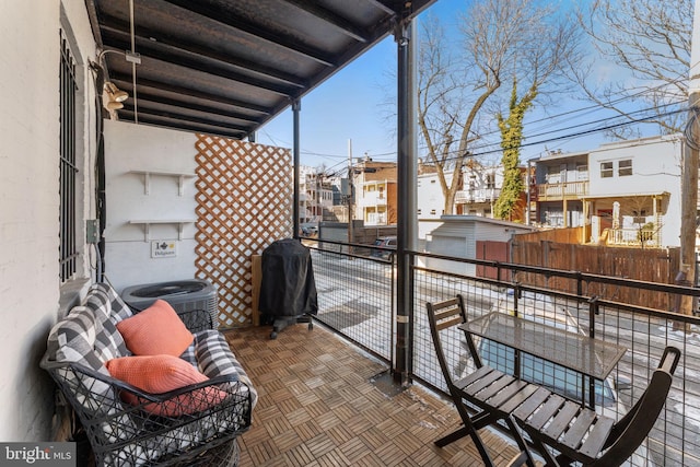 balcony featuring central AC unit and grilling area