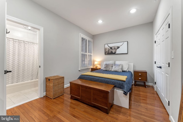 bedroom with a closet and wood-type flooring