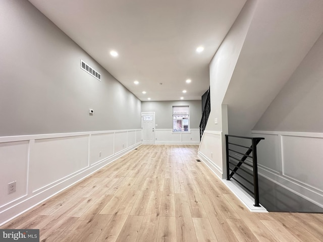 bonus room with light hardwood / wood-style floors