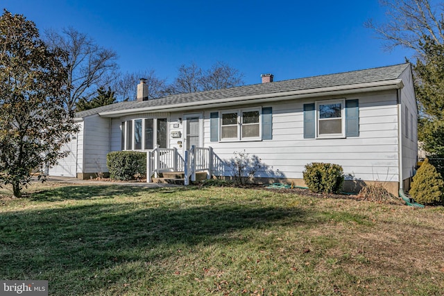 ranch-style home with a front yard