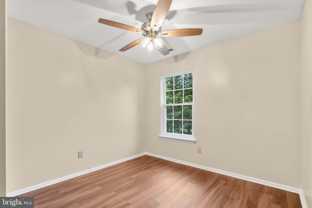 empty room featuring hardwood / wood-style floors and ceiling fan